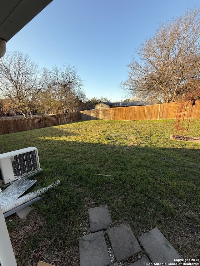 view of yard with central AC unit