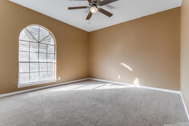 carpeted empty room with ceiling fan