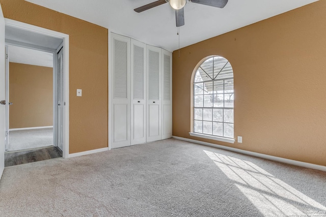 unfurnished bedroom with carpet and ceiling fan