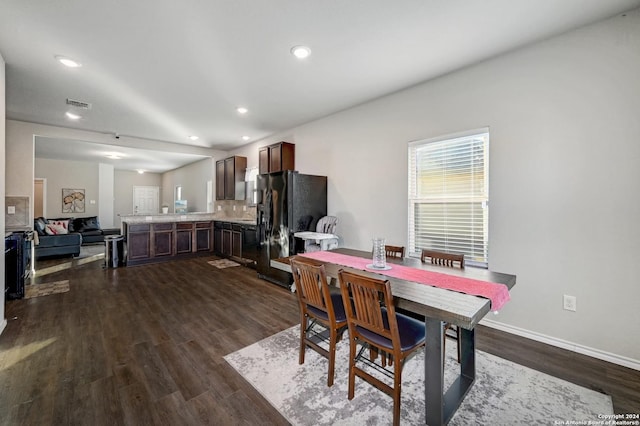 dining room with dark wood-type flooring