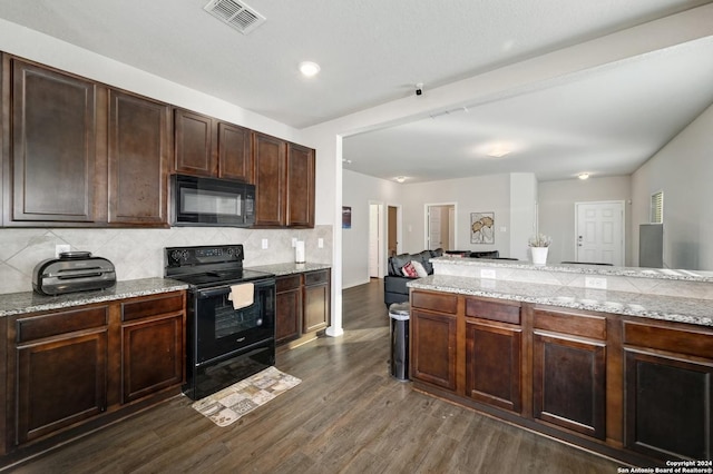 kitchen featuring light stone counters, dark hardwood / wood-style floors, backsplash, dark brown cabinets, and black appliances