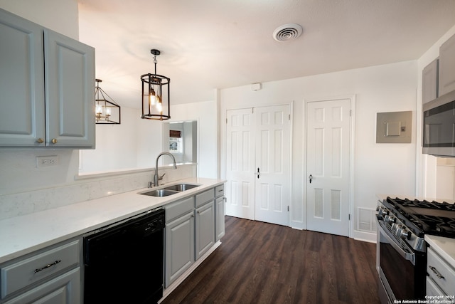 kitchen featuring a chandelier, stainless steel appliances, gray cabinets, and sink