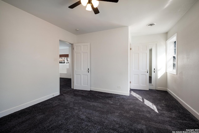 carpeted empty room with ceiling fan