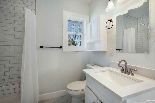 bathroom with vanity, toilet, and curtained shower