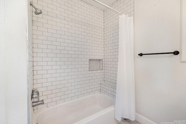 bathroom featuring shower / bath combination with curtain