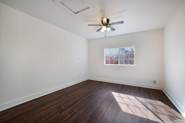 spare room with ceiling fan and dark hardwood / wood-style floors