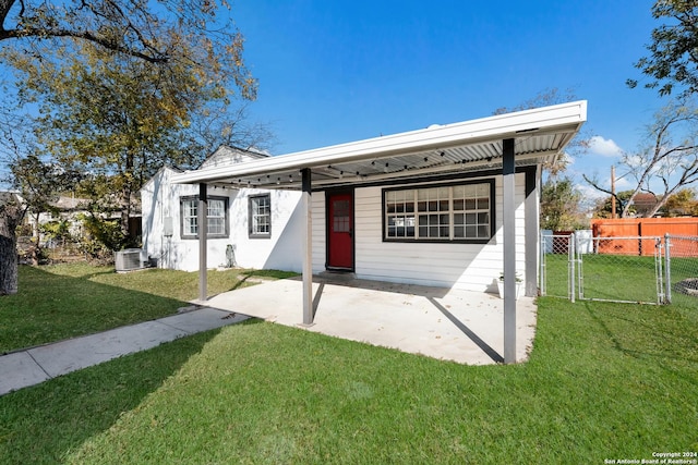 view of front of property with a front lawn and a patio