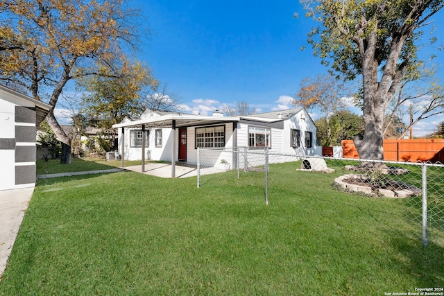 rear view of property featuring a patio area and a yard