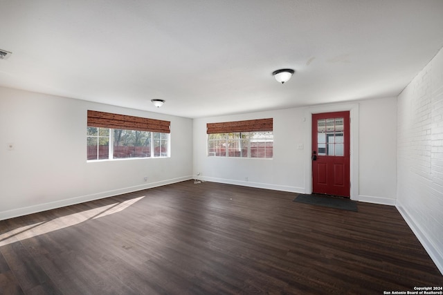 interior space with dark hardwood / wood-style floors