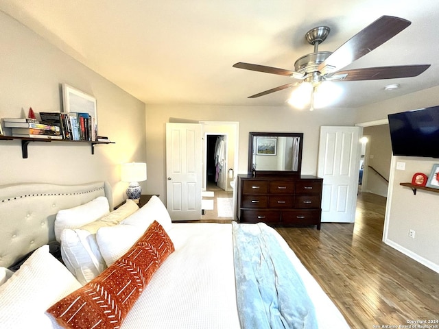 bedroom with ceiling fan and hardwood / wood-style floors