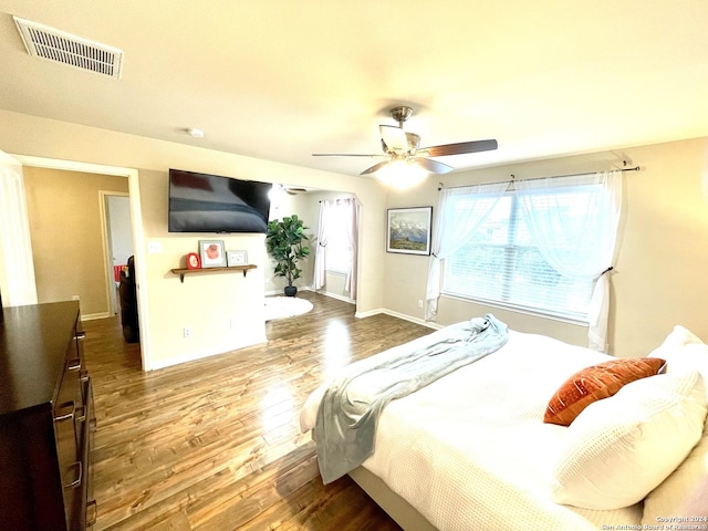 bedroom featuring hardwood / wood-style flooring and ceiling fan