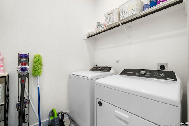 laundry area featuring washing machine and clothes dryer