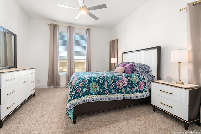 bedroom with light carpet and ceiling fan