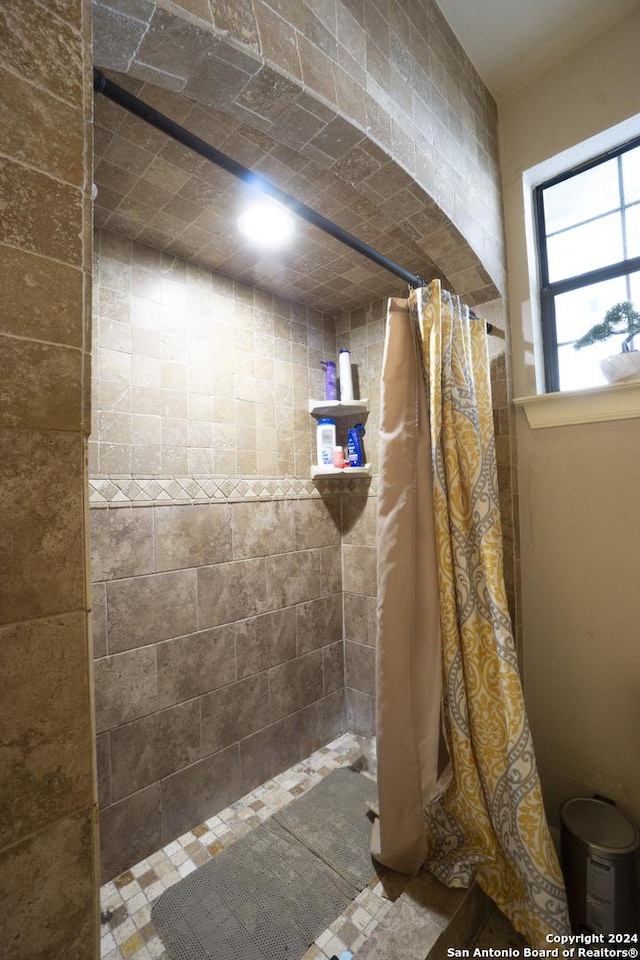 bathroom featuring a shower with curtain