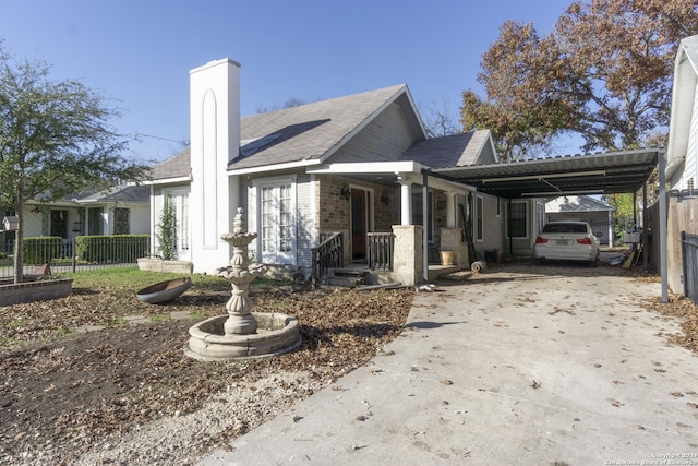 view of side of home with a carport