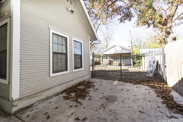 view of property exterior featuring a garage and an outdoor structure