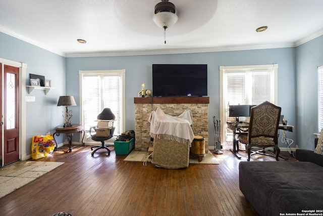 bedroom with ceiling fan, hardwood / wood-style floors, and ornamental molding