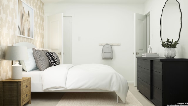 bedroom featuring light colored carpet