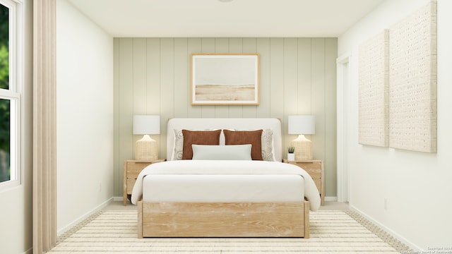 carpeted bedroom featuring wooden walls and multiple windows