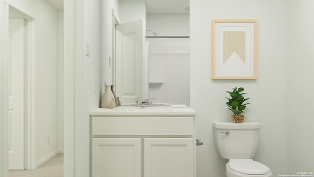 bathroom with vanity, toilet, and walk in shower