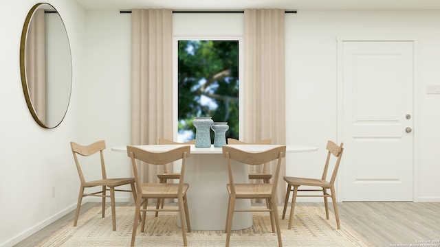 dining space featuring hardwood / wood-style floors