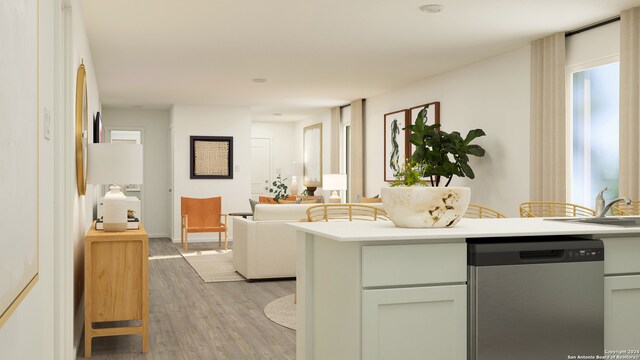 kitchen with dishwasher, light hardwood / wood-style floors, white fridge, and sink