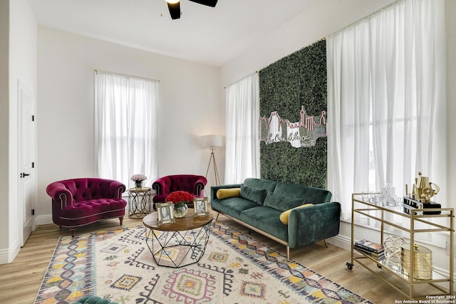 living room featuring a wealth of natural light, ceiling fan, and hardwood / wood-style floors