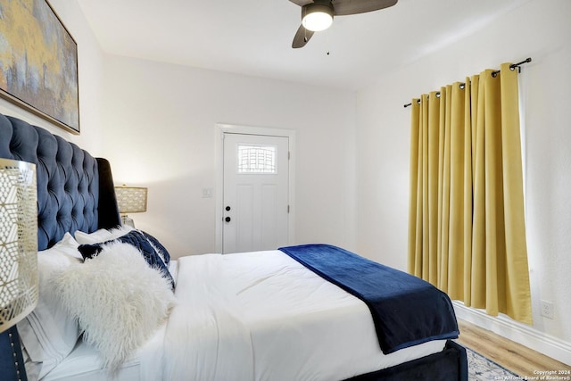 bedroom featuring ceiling fan and wood-type flooring