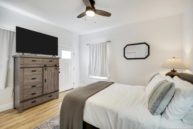 bedroom featuring light hardwood / wood-style floors and ceiling fan