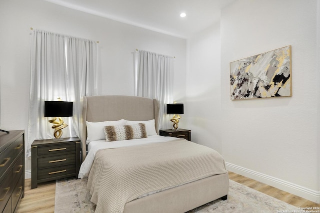 bedroom with light wood-type flooring