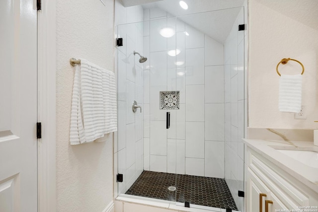 bathroom featuring vanity, walk in shower, and lofted ceiling