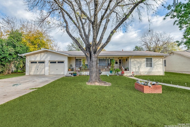 ranch-style house with a front yard, a porch, and a garage