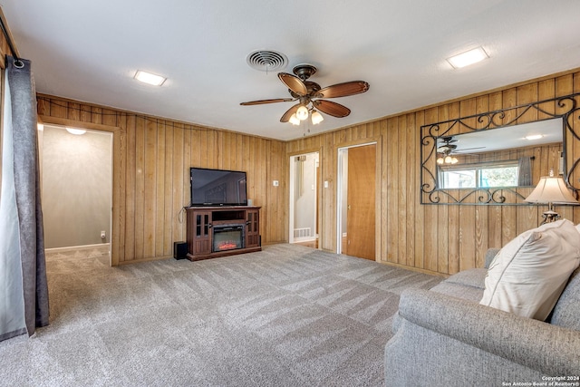 living room featuring carpet flooring and ceiling fan