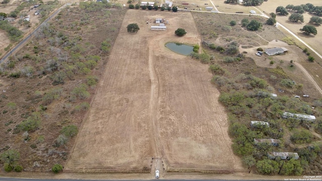 birds eye view of property featuring a rural view