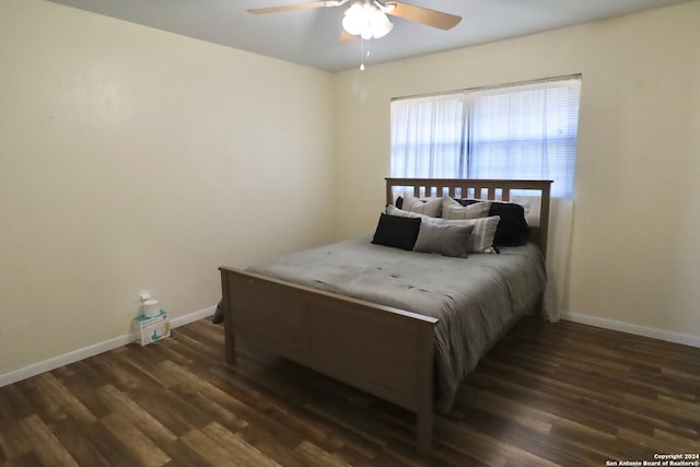 bedroom featuring ceiling fan and dark hardwood / wood-style floors