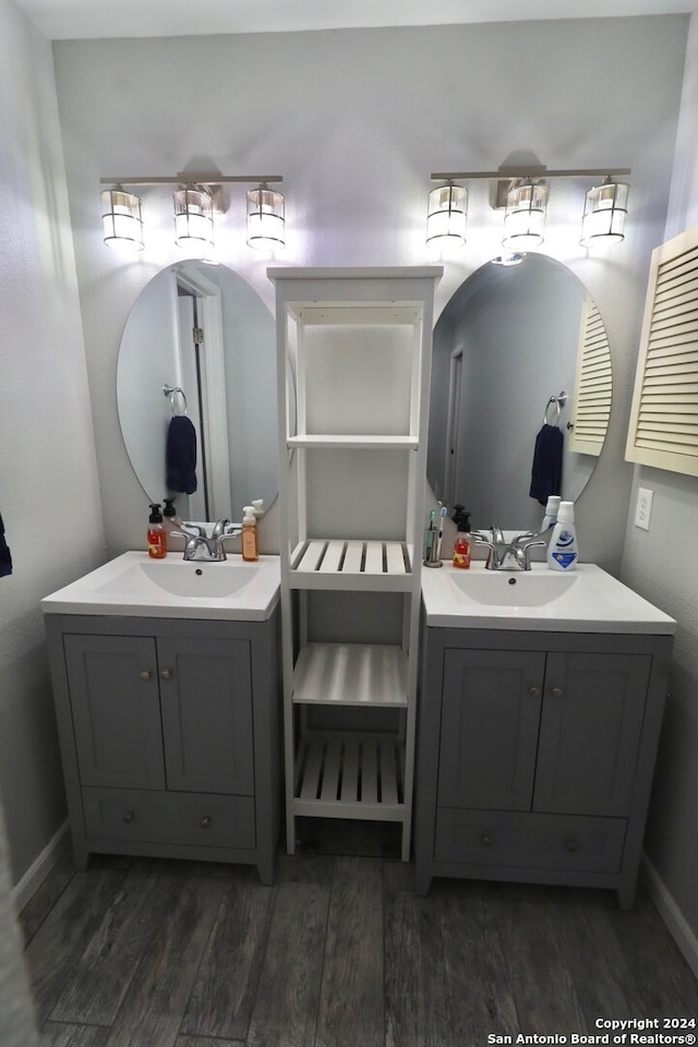 bathroom with hardwood / wood-style flooring and vanity