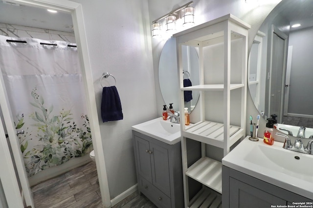 bathroom featuring vanity, toilet, and walk in shower