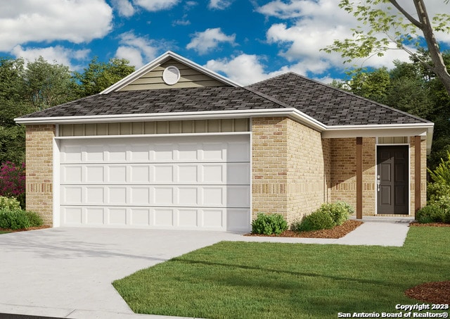 view of front of property with a front lawn and a garage