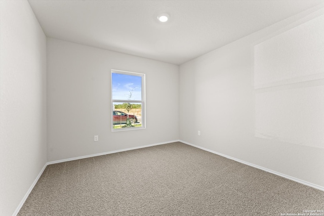 unfurnished room featuring carpet flooring