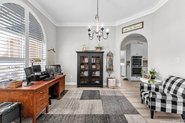 home office featuring ornamental molding, light hardwood / wood-style flooring, and a notable chandelier