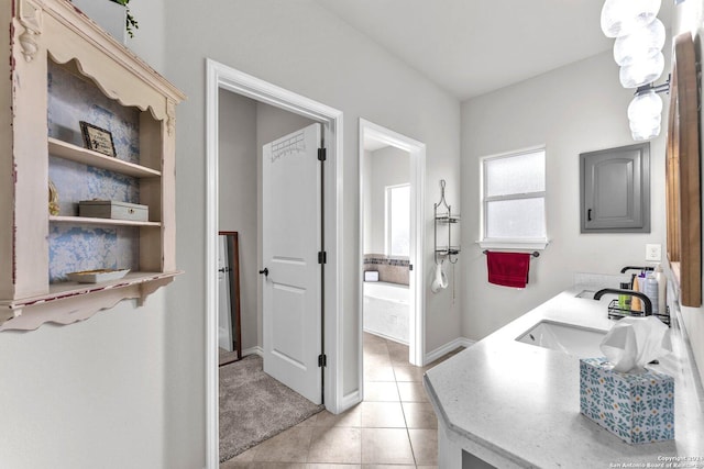 bathroom with tile patterned floors and vanity