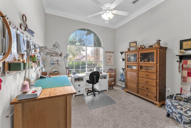 home office featuring ceiling fan, crown molding, and carpet