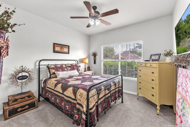 bedroom featuring light carpet and ceiling fan