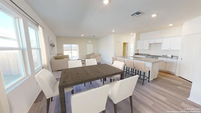 dining room featuring light wood-type flooring