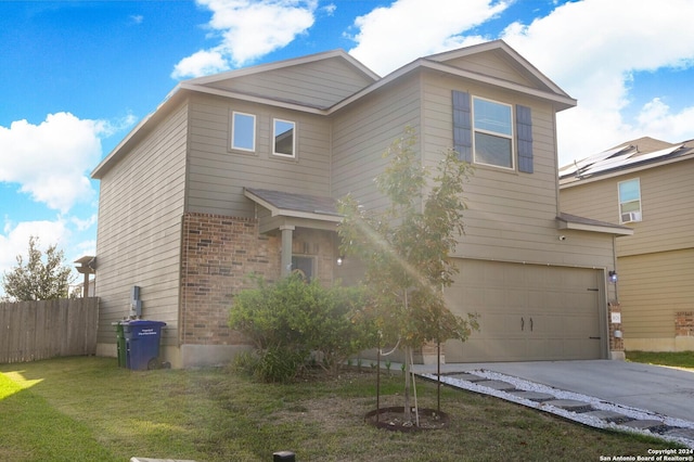 view of front of home with a garage and a front yard