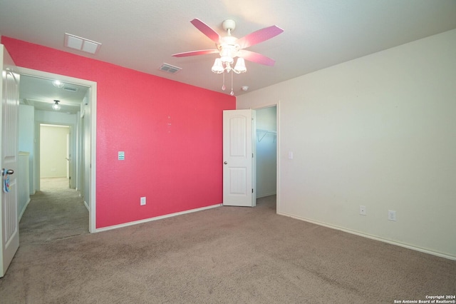 unfurnished bedroom featuring ceiling fan and light colored carpet