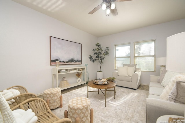 living room featuring ceiling fan and light wood-type flooring