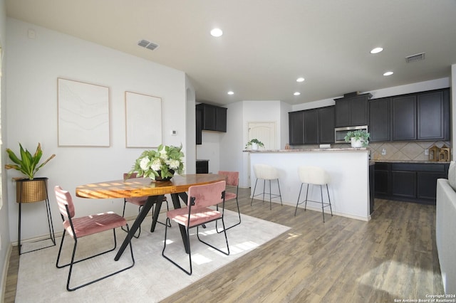 dining room featuring light hardwood / wood-style flooring