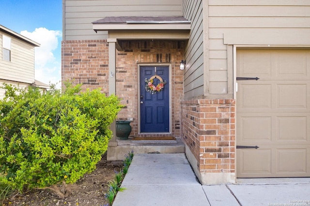 property entrance with a garage