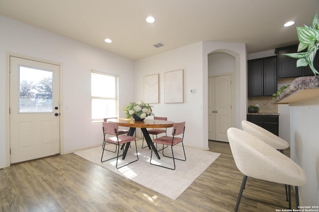 dining area featuring dark wood-type flooring